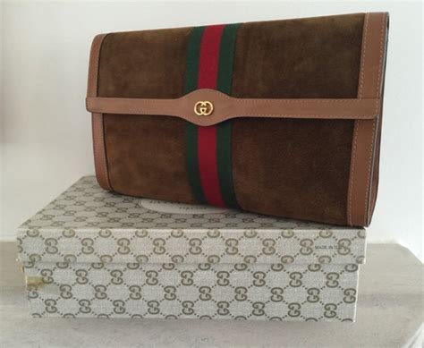 clutch oro gucci|Gucci vintage suede clutch.